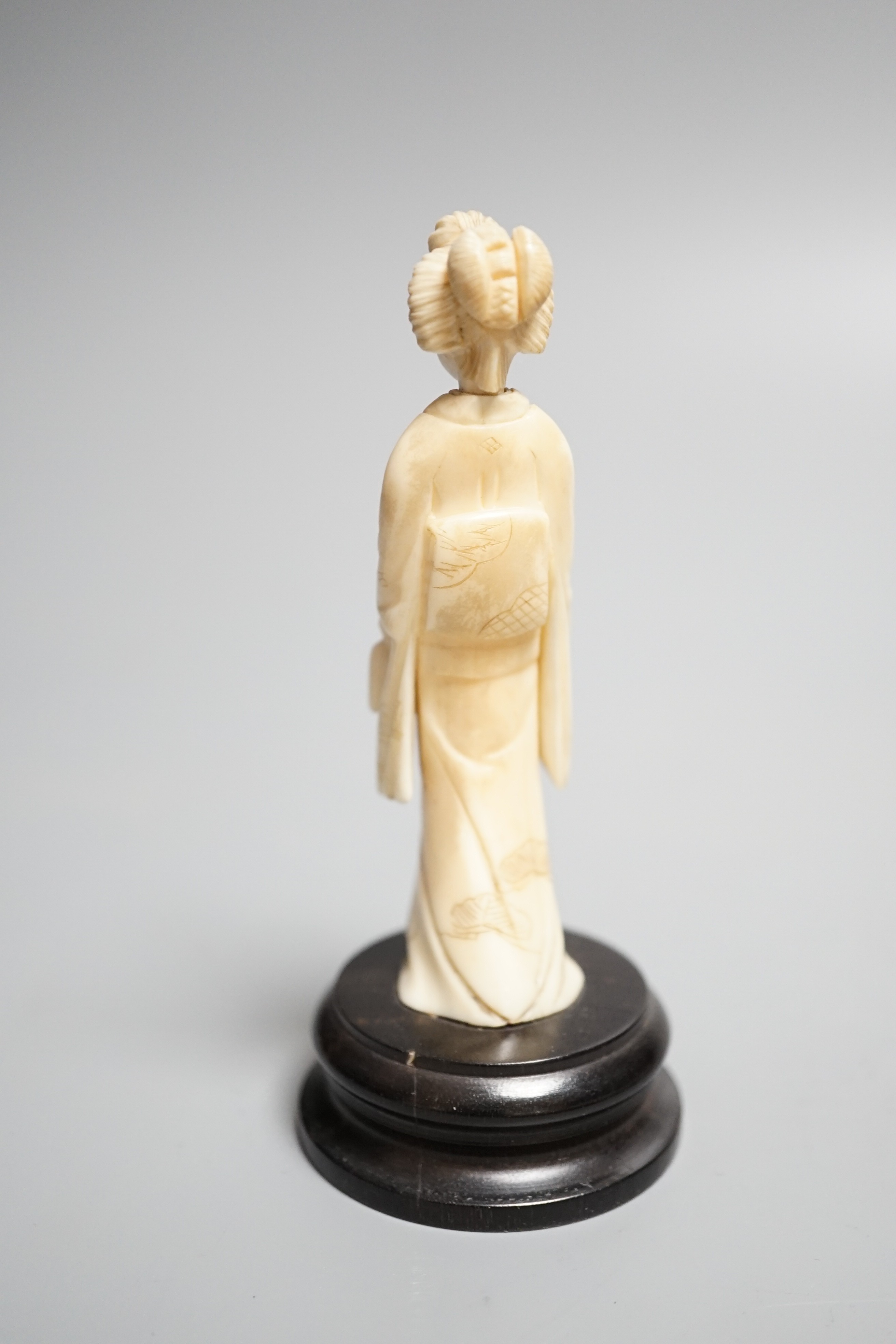 A Chinese export carved ivory bodkin case, 16cm, and a Japanese ivory figure of a geisha